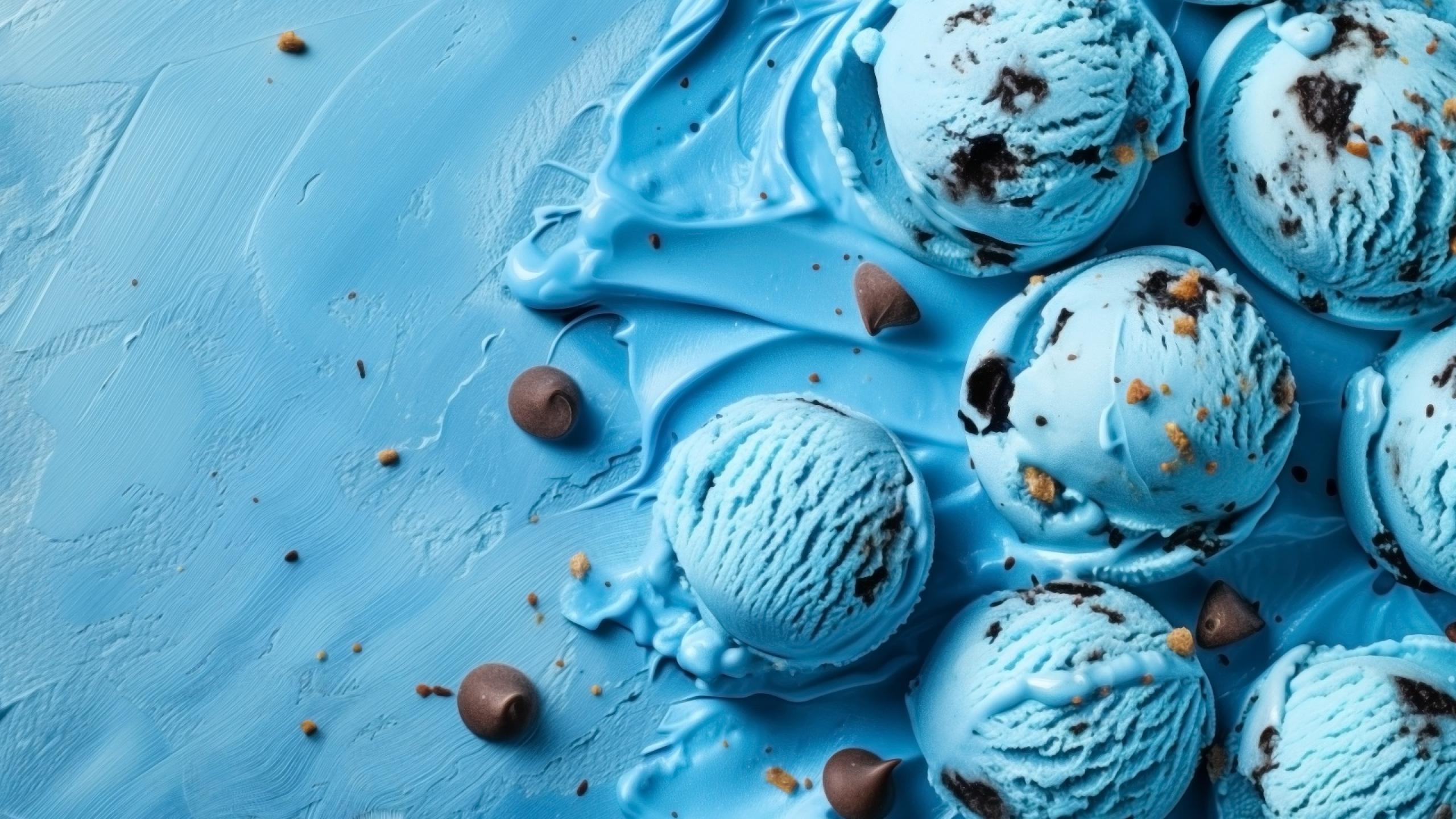 blue-ice-cream-scoops-with-chocolate-chips-sprinkles-textured-background